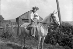 2424-Woman-on-Horse-44C0F4